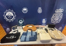Confiscan más de un millar de bolsos falsificados de marcas de lujo en una nave industrial de Elche